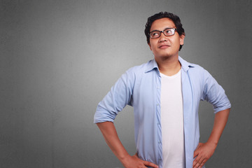 Obraz premium Young Man Thinking, Smiling Expression