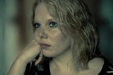 Young blond woman thinking deep thoughts