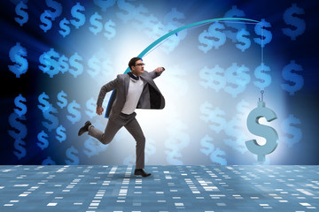 Businessman chasing money on fishing rod