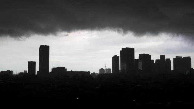 Bangkok,Thailand - September 3, 2018 :  Dark cloud moving before raining over skyscraper and building residential at Bangkok