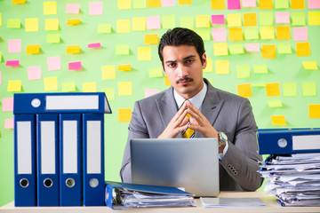 Businessman having trouble with his priorities