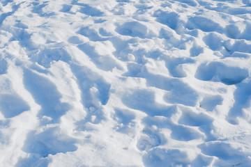 Footprints in the snow. Snow background.