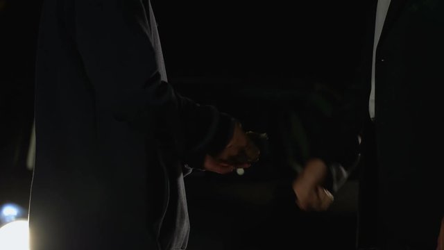 Business person buying amphetamine from street dealer, smuggling, addiction