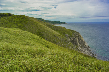 Velvet green hills and the blue sea