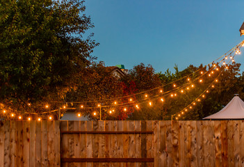 Party lights hanging down from a house