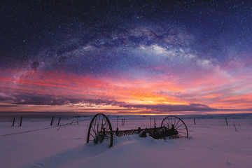 Panoramic winter landscape in sunrise with double exposure night sky landscape