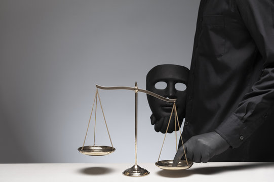 Man holding evil mask