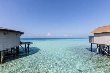 Beautiful luxury villas over water on tropical island resort in Maldives with turquoise sea and sunset,Vacation Destination in holiday relax with nature in summer