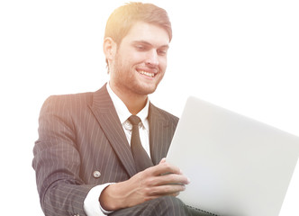 handsome young business man sitting on a white modern chair