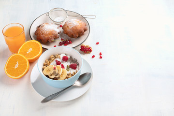 Bowl of granola with yogurt and fresh berries