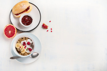 Bowl of granola with yogurt and fresh berries