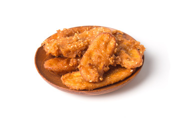 Fried bananas in plate isolated on white background, Kluay Tod - Thai dessert.