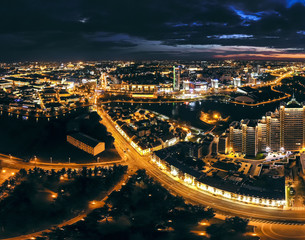Fototapeta na wymiar Night cityscape from birds eye view. Aerial view of Minsk City downtown at night