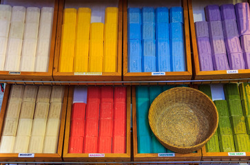 Colorful natural handmade soap in wooden boxes at a market in Grasse Provence France