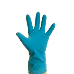 Obraz premium A hand in a blue glove on a white background