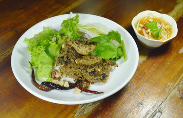 crispy fried minced catfish with green mango salad and sauce