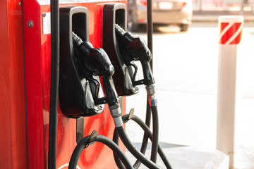 Petrol pump filling nozzles in gas station
