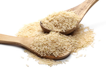 Integral rice pile isolated in wooden spoon on white background, clipping path