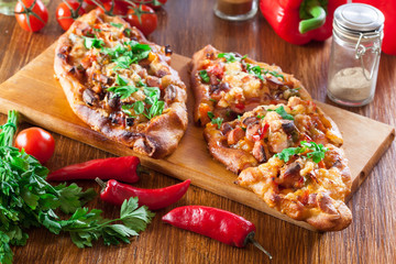 Sliced traditional Turkish pide with meat and vegetables
