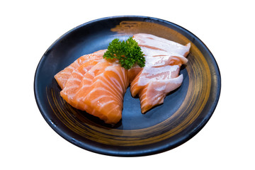 Fresh raw salmon on black plate