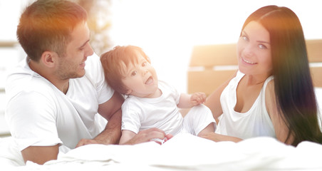 A young family with young children to bed in the bedroom