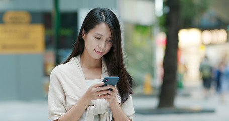 Woman use of mobile phone for sending sms