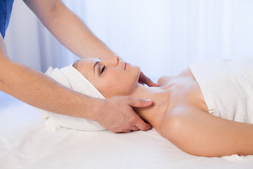 Obraz na płótnie Canvas face and neck massage beautiful woman at Spa