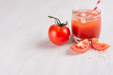Summer fresh drink - cold alcoholic cocktail bloody Mary - pulpy red tomato juice on light white wooden board, copy space, top view.