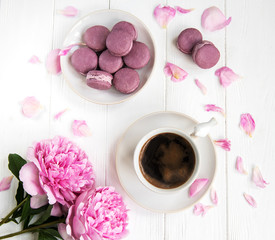 Pink peony with coffee and macarons