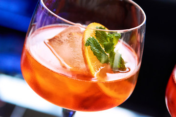 Aperol Spritz preparation of a bright alcoholic cocktail