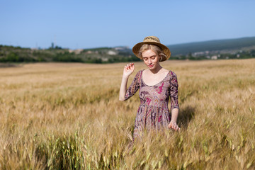 beautiful woman farmer in field of wheat farm