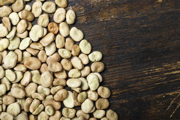 raw beans are scattered in a row