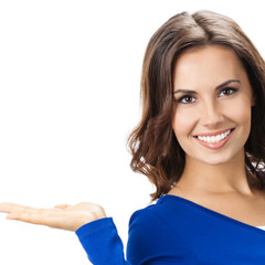 Beautiful young woman showing, on white