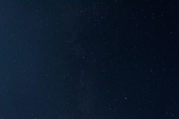 the background stars in the dark sky