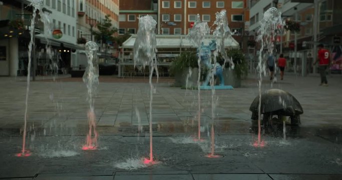 Water shooting from lit up holes in the ground in central V&auml;ster&aring;s