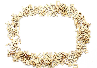 Wooden letters on white background. Copy space in the middle. 