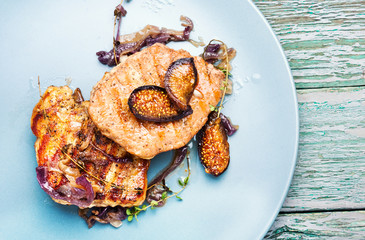 Meat steak with figs on plate