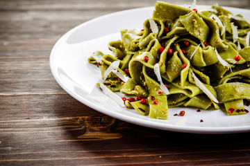 Pasta with cheese on wooden table