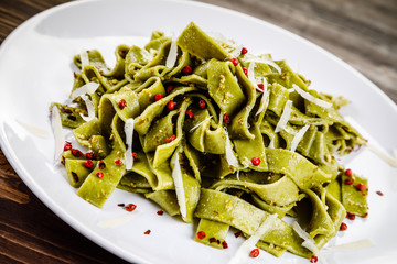 Pasta with cheese on wooden table