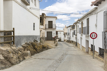 Fototapeta na wymiar a street in Ferreira town with typical white houses, province of Granada, Andalusia, Spain
