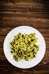 Pasta with cheese on wooden table