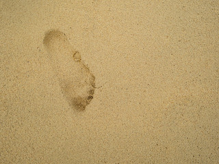 Fototapeta na wymiar Footprint on the tropical beach in vacation time