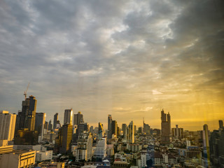 Obraz premium Bangkok city scape with orange sunset sky