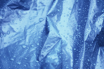 Wet plastic surface with drops of rain
