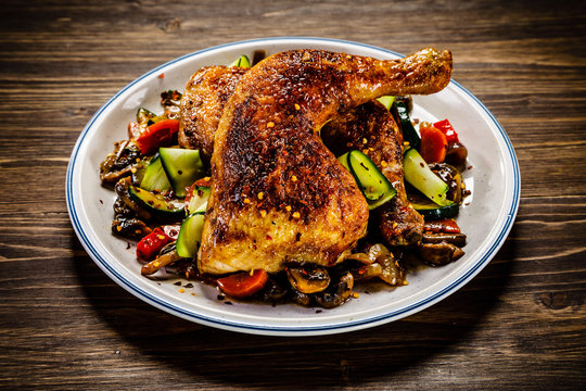 Barbecued chicken leg with vegetables