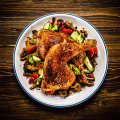 Barbecued chicken leg with vegetables