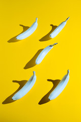 White banana on yellow background