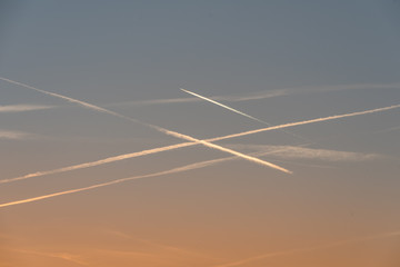 planes crossing the sky at sunrise over Stuttgart