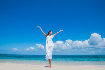 Woman in dress on beach