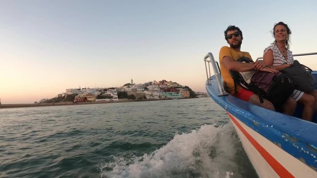 Adventurous couple travel by boat to a small town on the Moroccan coast, Moulay Bousselham